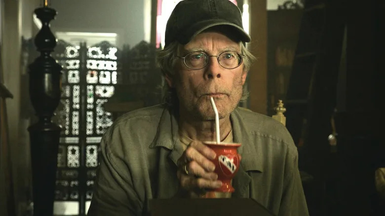 Stephen King having a drink in It Chapter 2