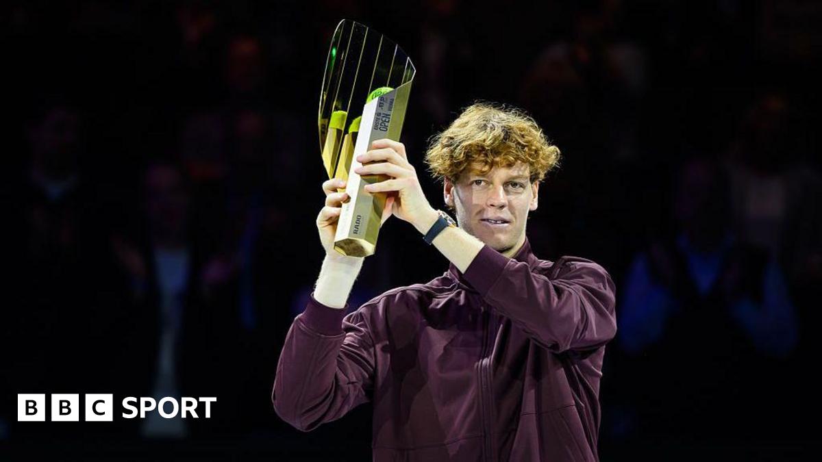 Jannik Sinner of Italy poses with his Vienna Open trophy