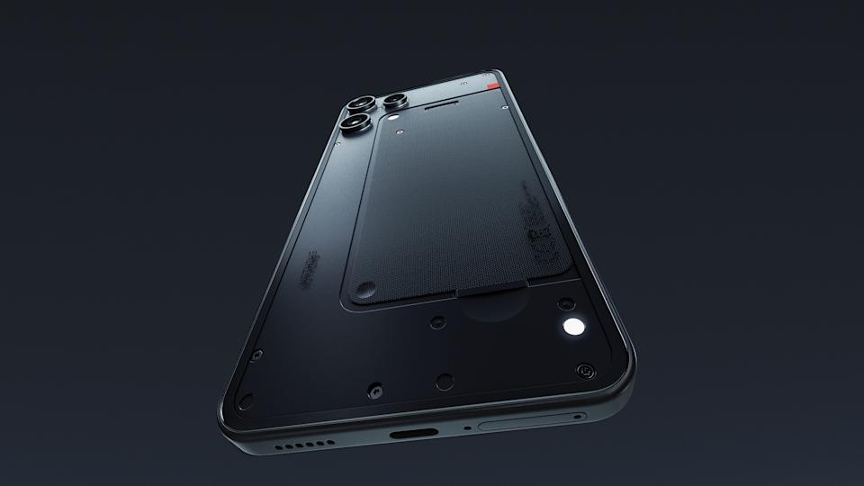 Dramatic view of the Nothing Phone 3a Lite smartphone. Its notification LED is lit, as the black phone floats against a dark background.