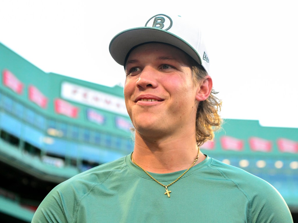 Boston Red Sox pitcher Connelly Early talking to media before a game.