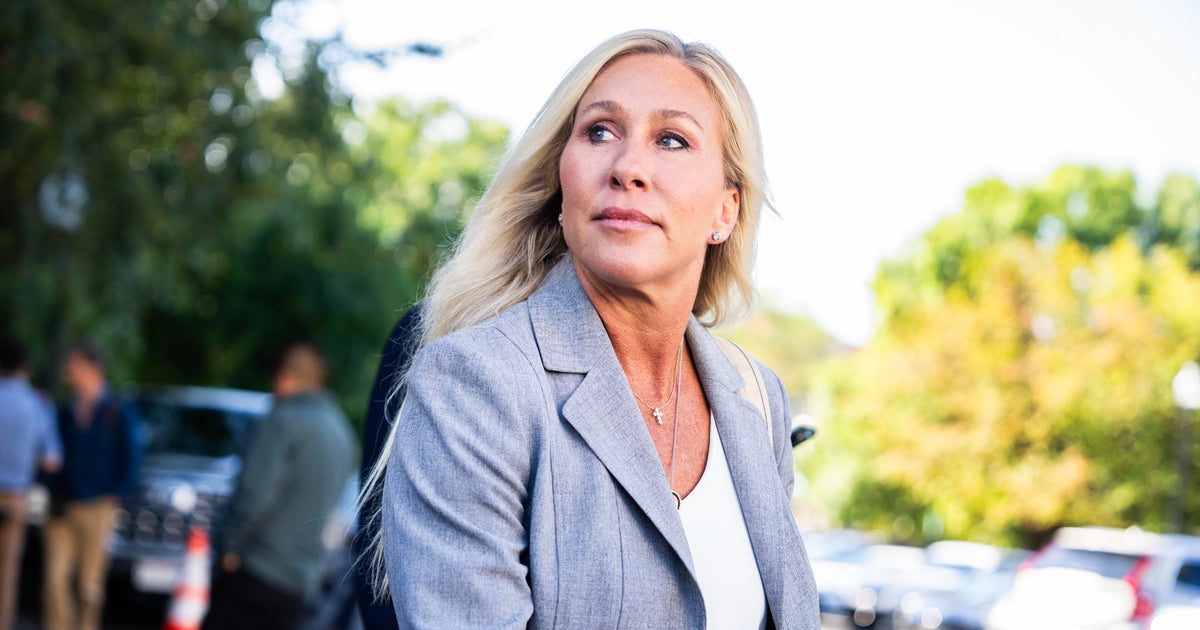 Rep. Marjorie Taylor Greene talks with reporters after a meeting of the House Republican Conference at the Capitol Hill Club on Tuesday, September 9, 2025.