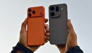 A person holding the iPhone 17 Pro Max and Oppo Find X9 Pro