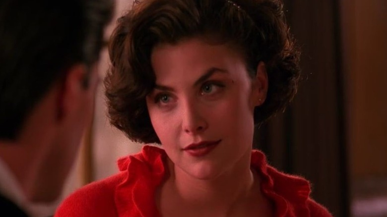 Sherilyn Fenn's Audrey Horne wearing red and facing Kyle MacLachlan's Dale Cooper on Twin Peaks