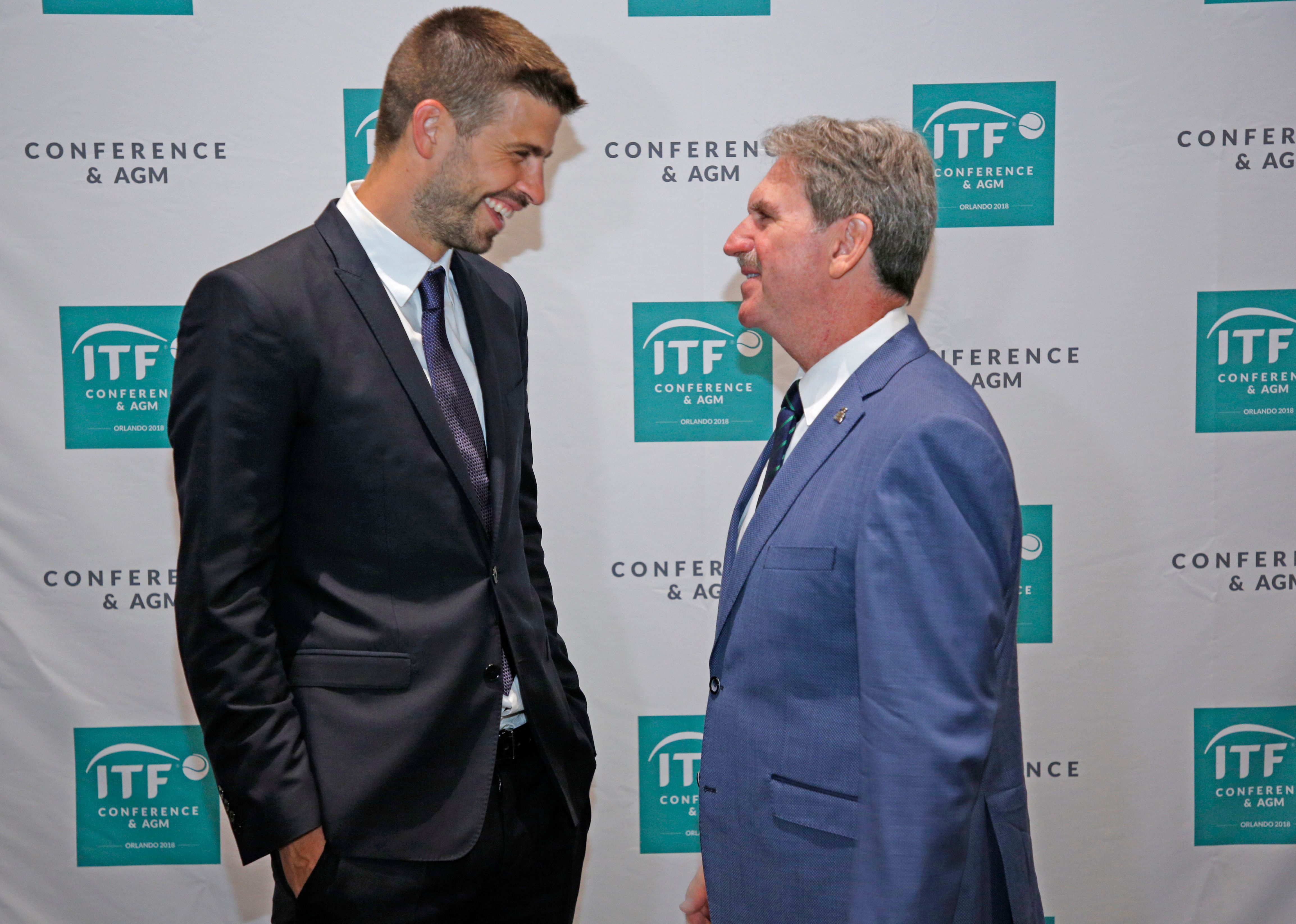David Haggerty, President of the International Tennis Federation, speaks with Gerard Pique, Founder of Kosmos sports group.