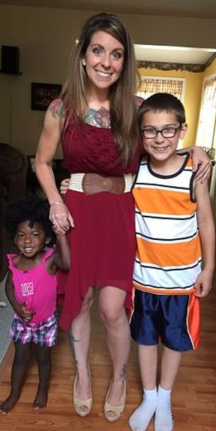 After losing the weight, Dr Booth said that she has kept it off for nine years. She is pictured above with two of her children