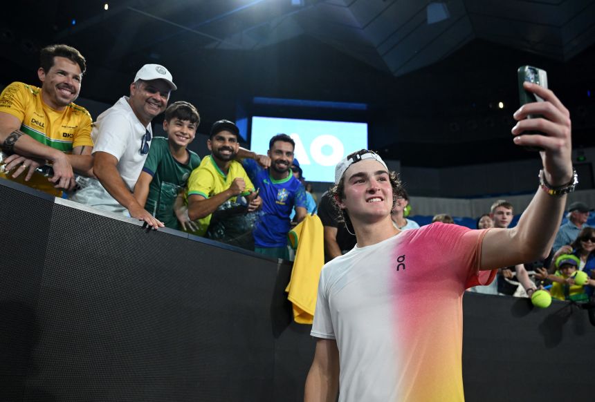 Fonseca takes a selfie with fans after winning his first-round match at the Australian Open in January.