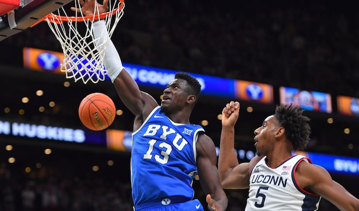 BYU center Keba Keita (13) takes a shot at the basket as UConn forward Tarris Reed Jr. (5) defends in the first half of an NCAA college basketball game, Saturday, Nov. 15, 2025, in Boston.