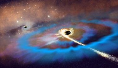 Artist’s interpretation of two massive black holes (MBHs) within a galaxy. Credit: NSF/AUI/NSF NRAO/P.Vosteen