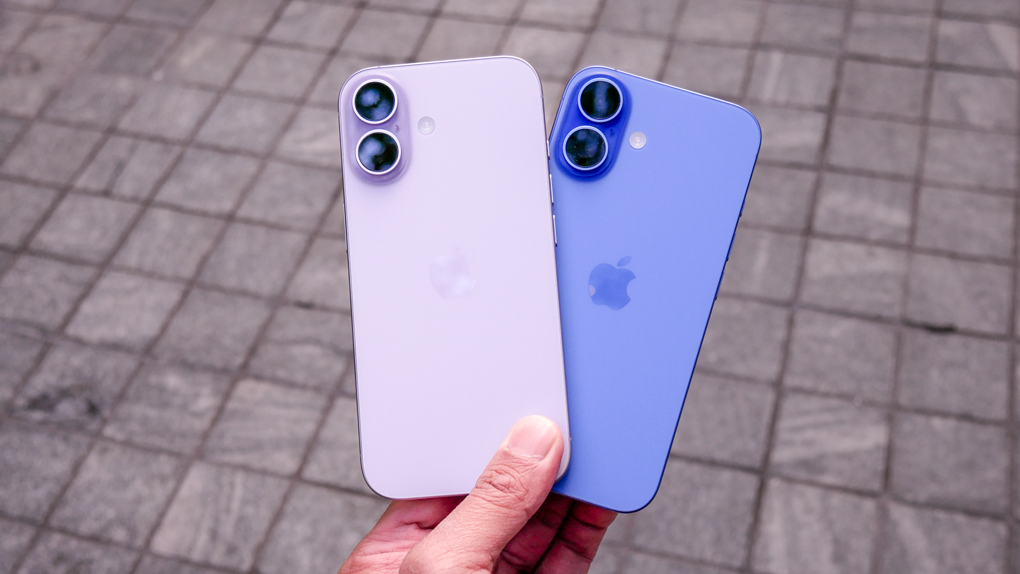 iPhone 17 vs iPhone 16 held in the hand.