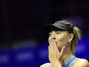 In this file photo taken on January 28, 2019, Russia's Maria Sharapova thanks supporters after defeating Australia's Daria Gavrilova during their match at the St. Petersburg Ladies Trophy tennis tournament at Saint Petersburg's Sibur Arena.  