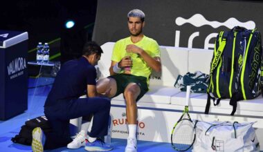Carlos Alcaraz receives a medical timeout during Sunday's Nitto ATP Finals title match against Jannik Sinner.
