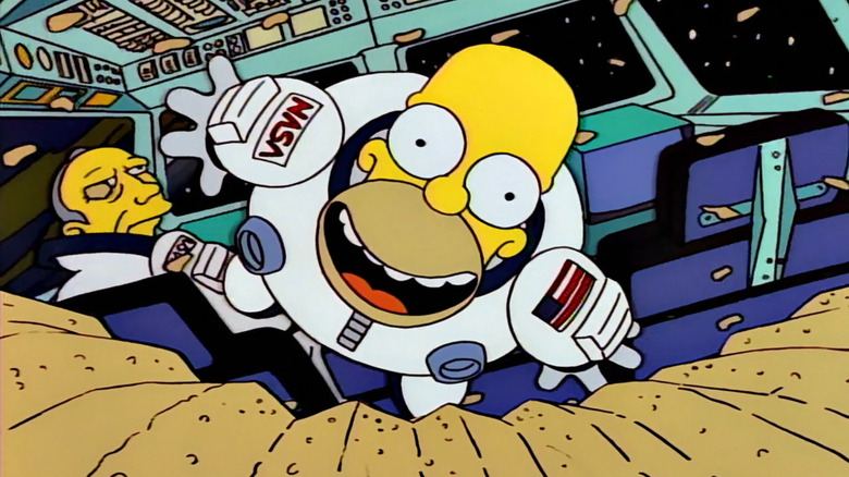 Homer flying toward a chip in space on The Simpsons