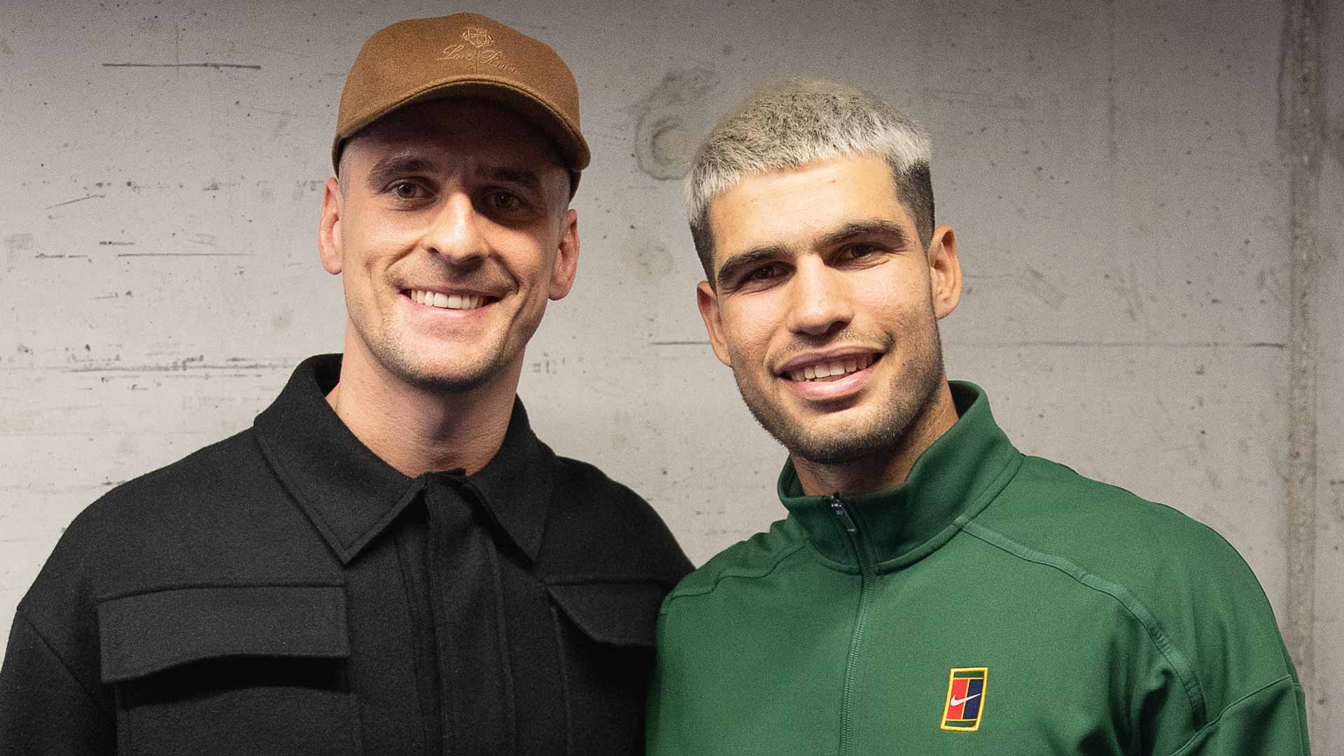 Arkadiusz Milik meets Carlos Alcaraz following the Spaniard's opening victory at the Nitto ATP Finals Sunday.