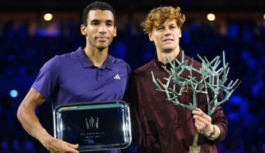 Felix Auger-Aliassime claims his finalist trophy after defeat to Jannik Sinner on Sunday in Paris.