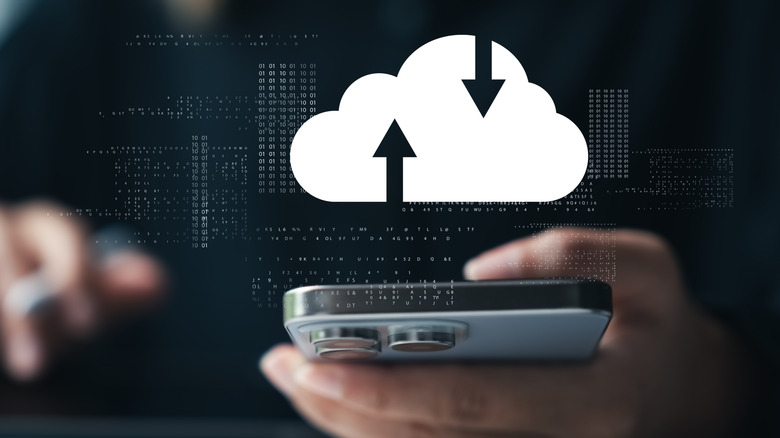 A person backing up their phone data to a cloud platform.