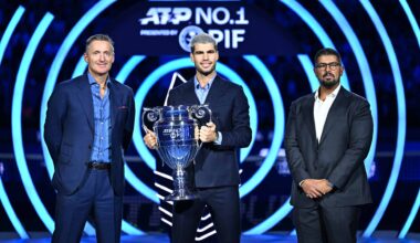 ATP Chairman Andrea Gaudenzi and Head of Corporate Brand and Strategic Advisory at PIF Mohamed Alsayyad present Carlos Alcaraz with the ATP Year-End No. 1 presented by PIF trophy.