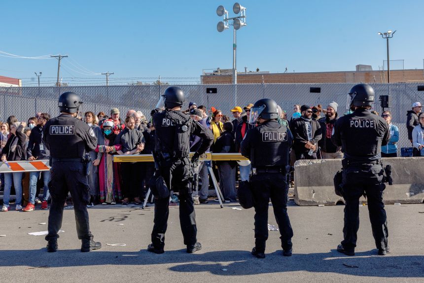 Officers face protesters after several people were detained earlier in the day at the US Immigration and Customs Enforcement holding facility in Broadview on November 14.