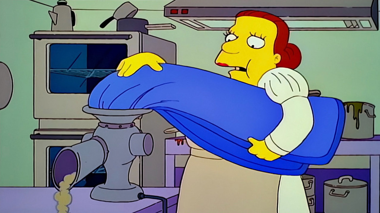 Lunchlady Doris putting a gym mat through a grinder on The Simpsons