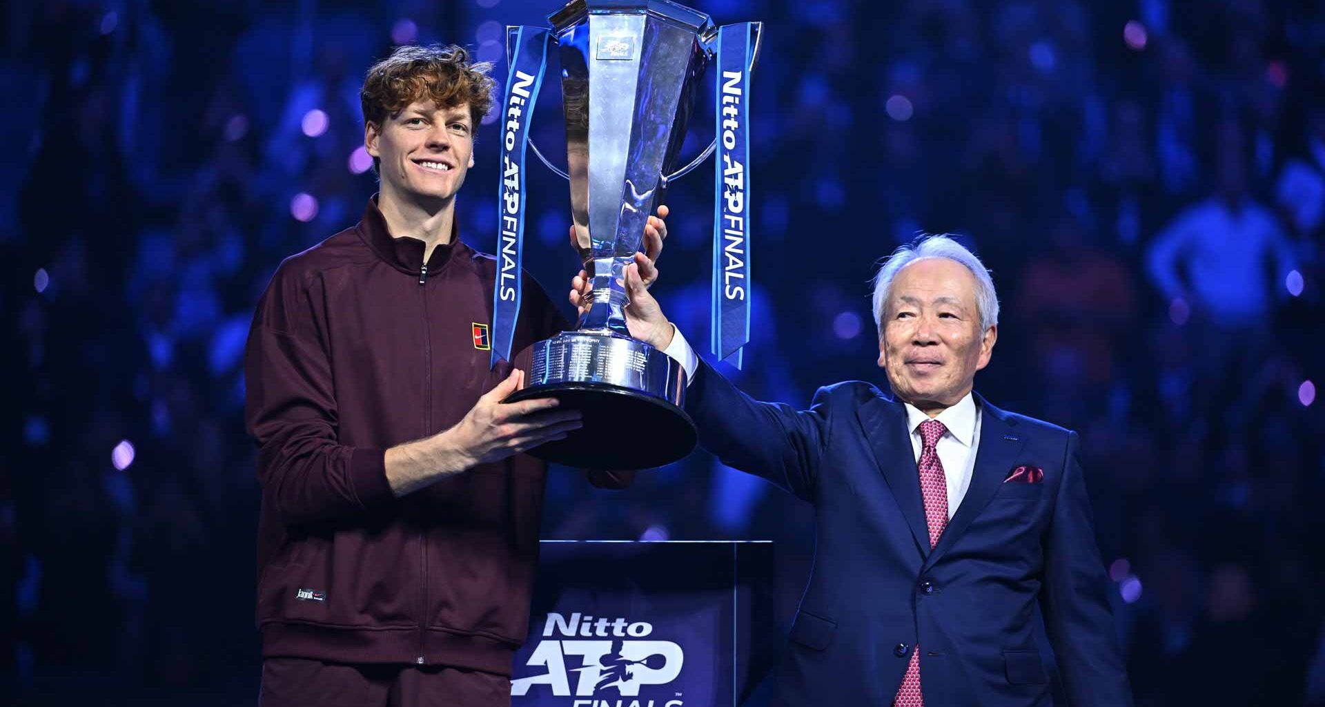 Nitto President and CEO Hideo Takasaki presenting the Nitto ATP Finals trophy to 2025 champion Jannik Sinner.