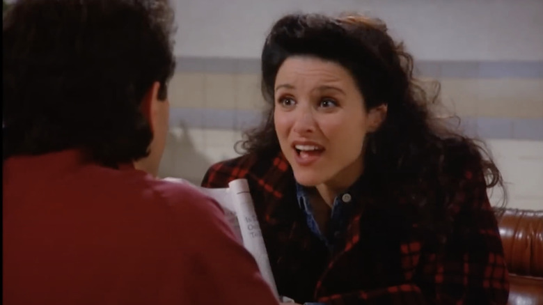 Julia Louis-Dreyfus as Elaine sitting across from Jerry Seinfeld as Jerry at a diner in Seinfeld