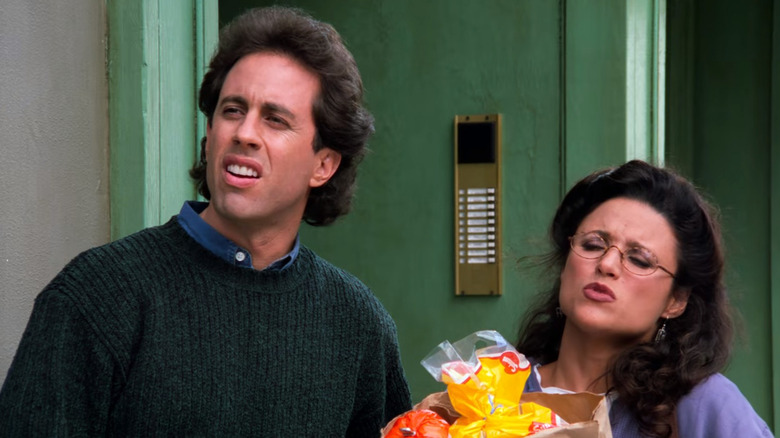 Jerry Seinfeld and Julia Louis-Dreyfus as Jerry and Elaine standing on the street in Seinfeld