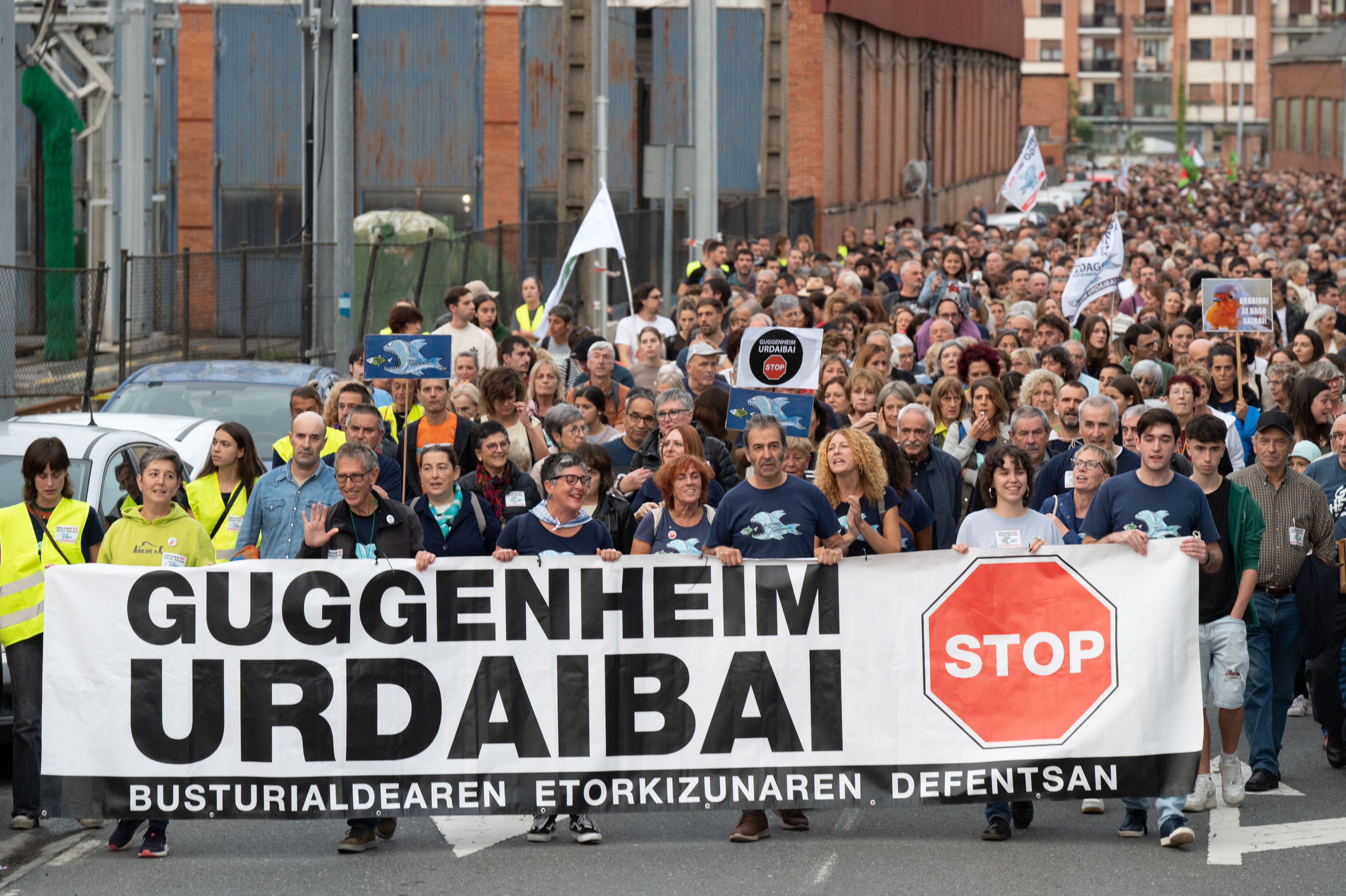 Demonstrators holding a "Guggenheim Urdaibai Stop" banner protest the construction of the Guggenheim Urdaibai museum.