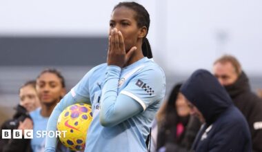 Khadija Shaw celebrates with the Manchester City fans