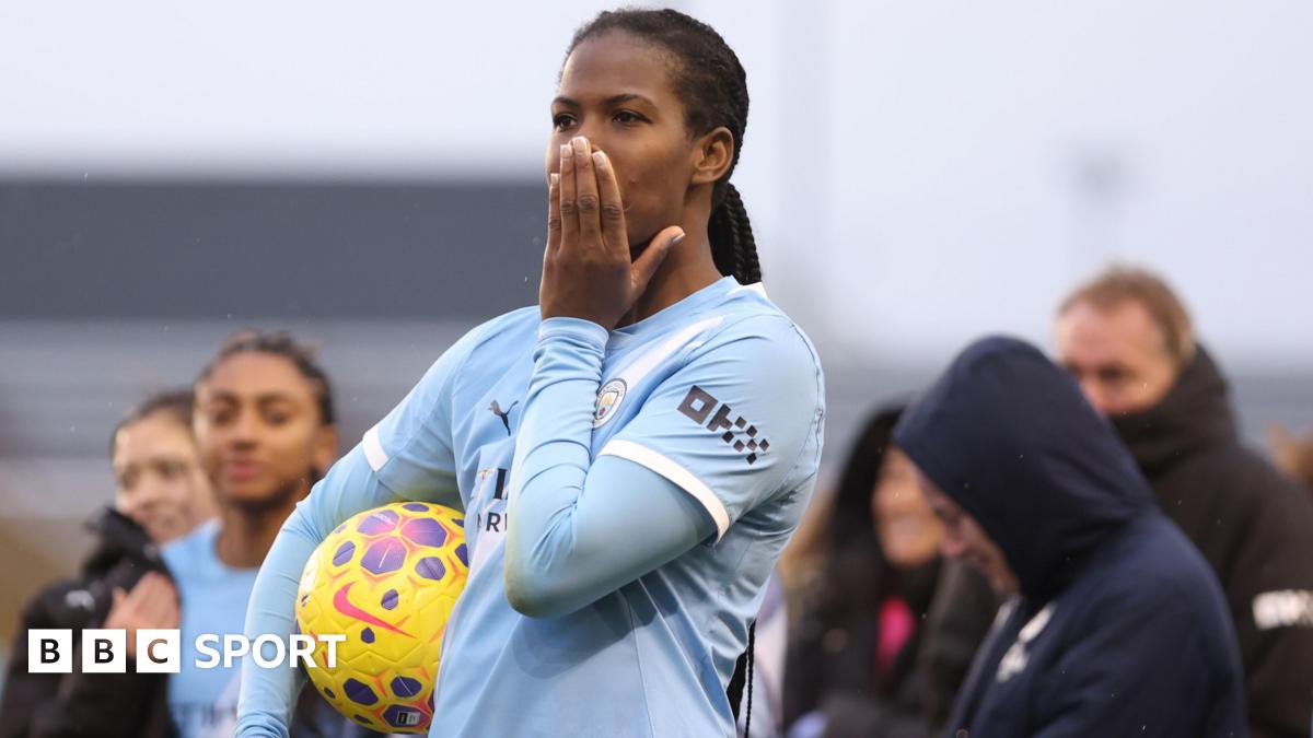 Khadija Shaw celebrates with the Manchester City fans