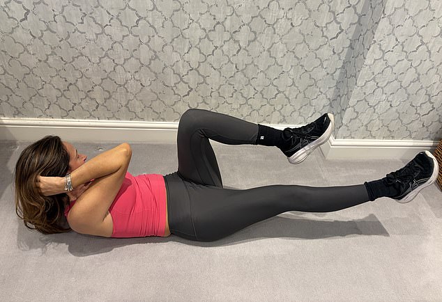 Pictured: Nancy demonstrating how to do a Russian Twist