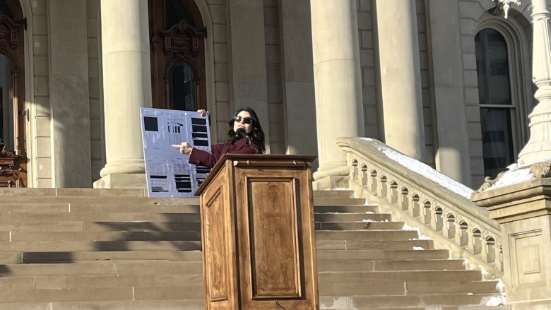 Attorney General Dana Nessel speaks at a podium