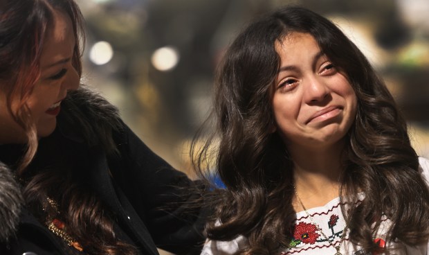 Mia Alonso Mendez, 12, tears up, as she takes her first look at refurbished statues of Cesar Chavez and Dolores Huerta at the studio of artist Mario Chiodo. Mendez pushed Napa city officials in 2024 to move the statues to a more central location in Napa, from their perch above a downtown business. At left is her mom Yessenia Mendez. Chiodo is the original sculptor. (Kent Porter / The Press Democrat)