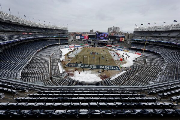A general view of snow covered seats are seen before the Pinstripe Bowl NCAA college football game between Clemson and Penn State at Yankee Stadium Saturday, Dec. 27, 2025, in New York. (AP Photo/Adam Hunger)
