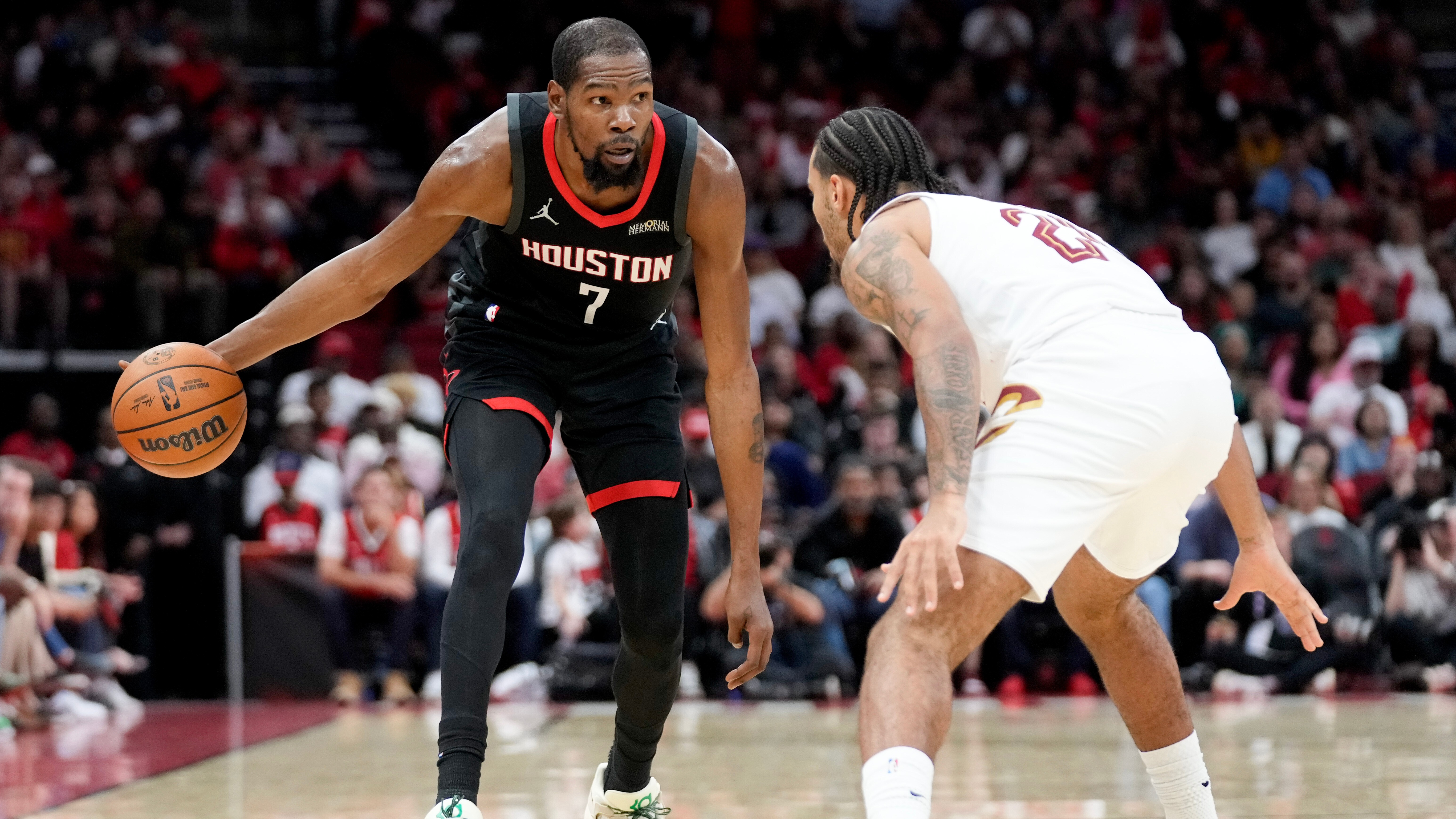 Rockets forward Kevin Durant (7) dribbles as Cavaliers guard Jaylon Tyson defends during the first half of an NBA basketball game, Saturday, Dec. 27, 2025, in Houston.
