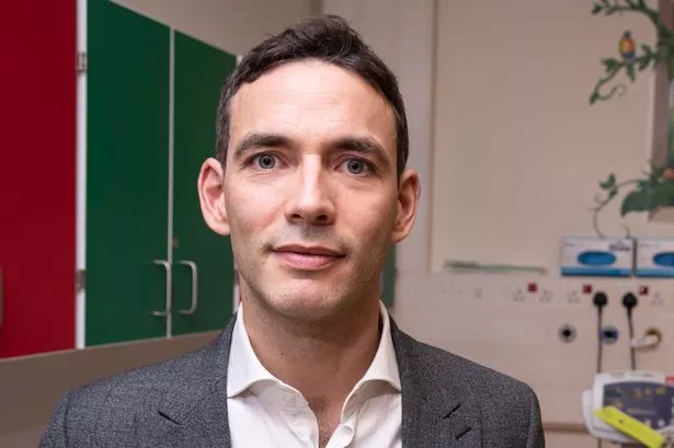 Man in suit and shirt without tie