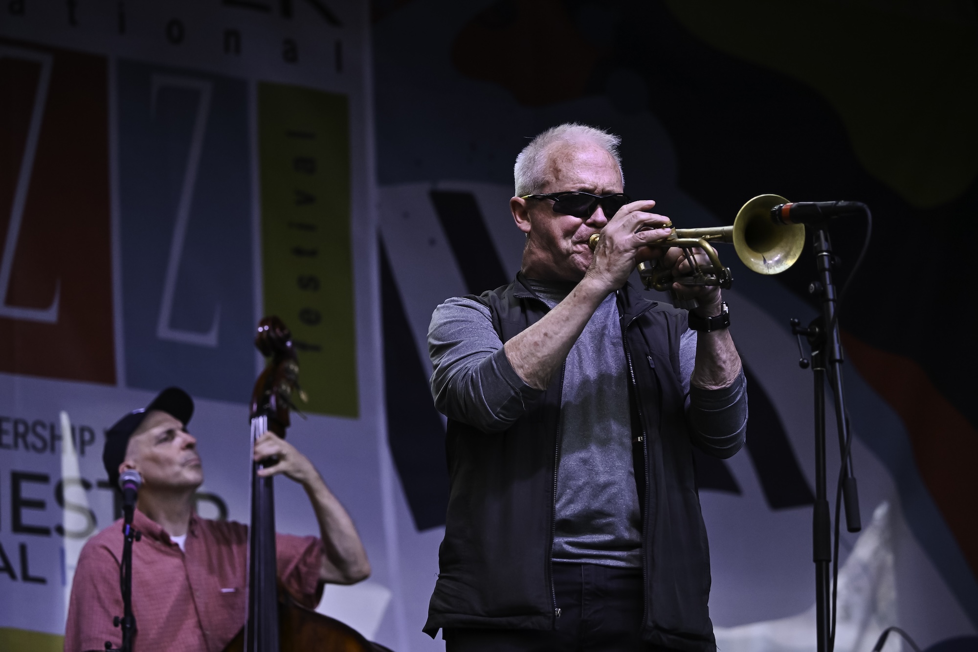 A bassist and trumpet player perform during Jazz Fest. 