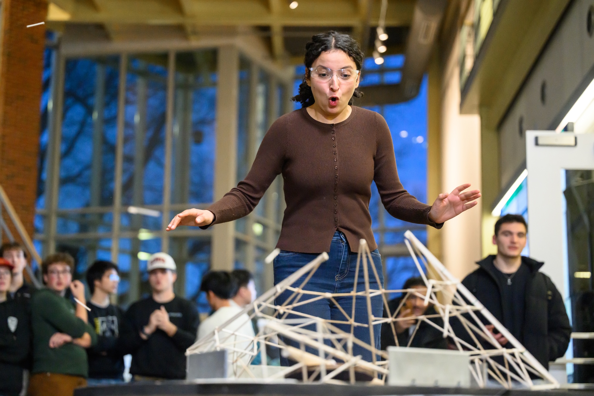 Amel Rouabhia reacts as her team’s balsa wood structure comes apart.