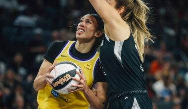 Los Angeles Sparks forward Dearica Hamby (5) is guarded by Aces center Elizabeth Kitley (33) du ...
