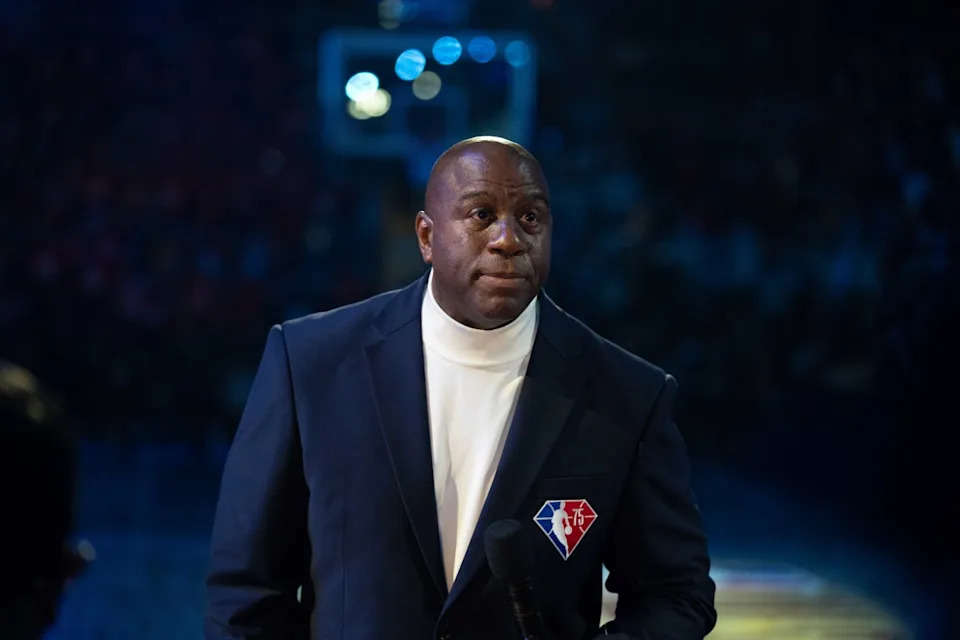 NBA legend Magic Johnson looks on during a ceremony.© Kyle Terada-Imagn Images