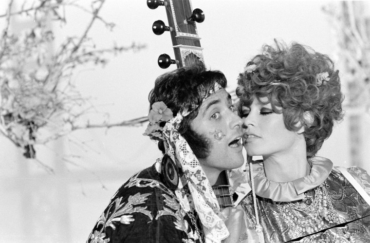 Brigitte Bardot and Sacha Distel, disguised as hippies, perform on the "Sacha Show" in 1967.