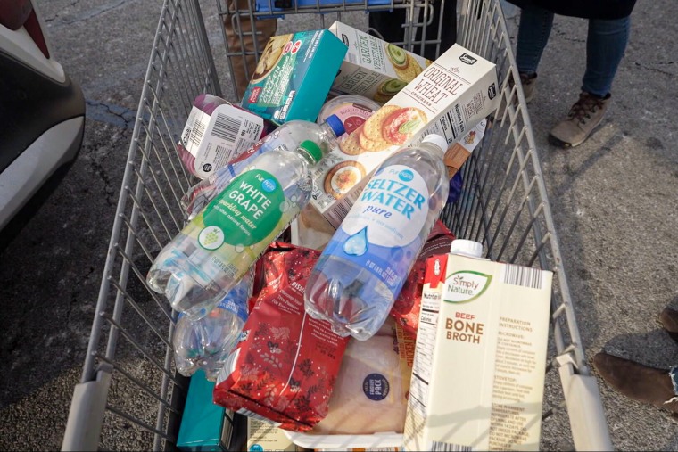 Brittany Zwier and Frank Martinez's grocery cart at Aldi, which does not provide traditional shopping bags.