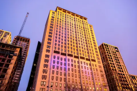 Getty Images A tall, multi storey building is seen in the evening light, is the global headquarters of Shell which is why this legal claim has been filed in London