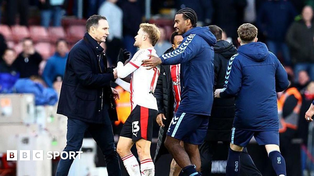 Players from both sides are involved in a melee on the pitch at St Mary's