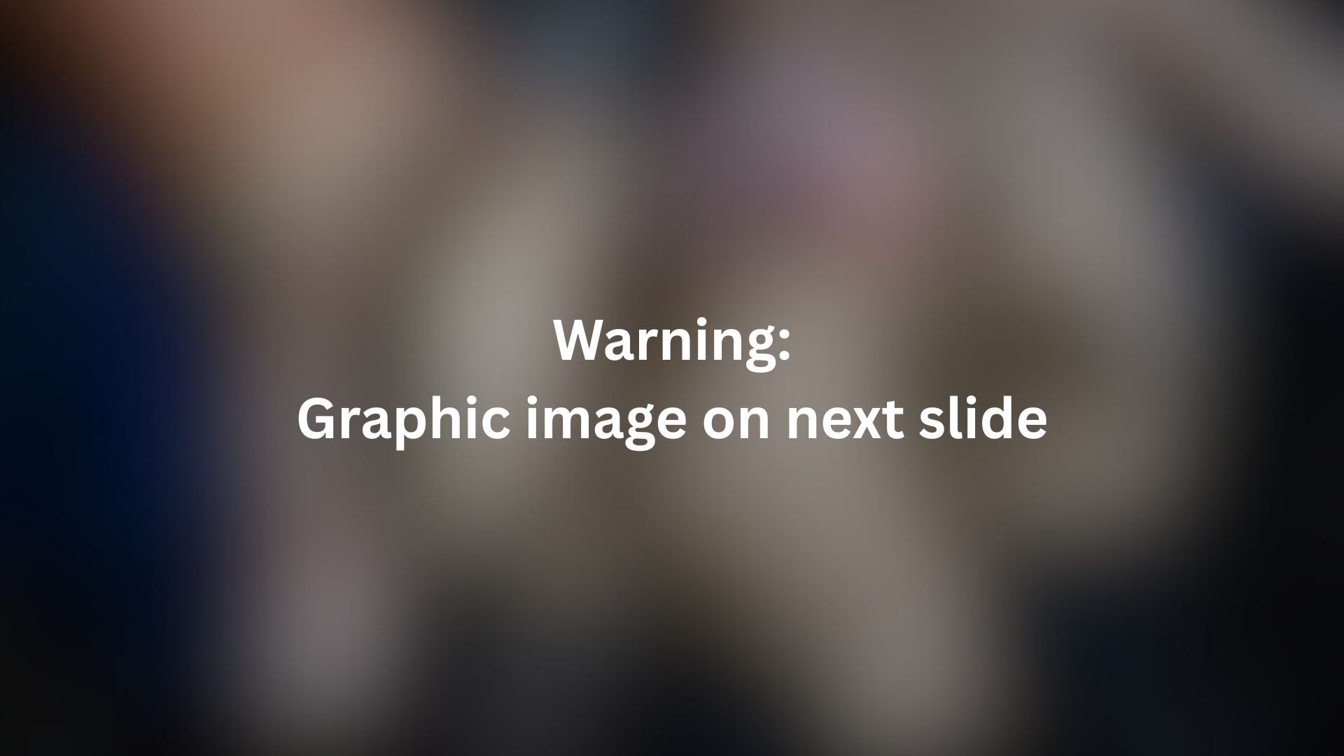 A content warning slide with a blurred image in the background.