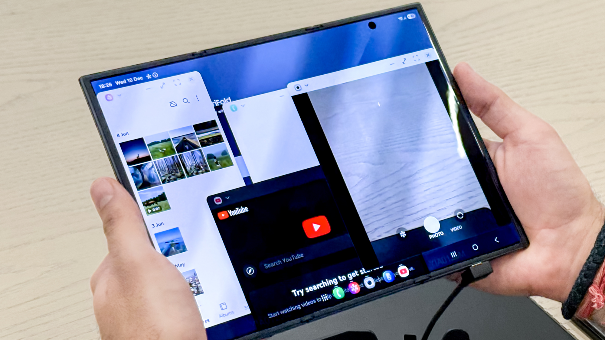 Samsung Galaxy Z TriFold fully open with multiple apps across the display
