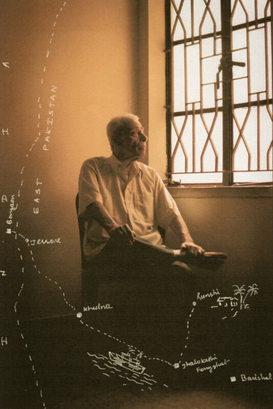 An elderly man sits by a sunlit window with crossed legs, gazing outside. A hand-drawn map and text are superimposed on the image, showing “East Pakistan,” rivers, and sketches of boats and trees.