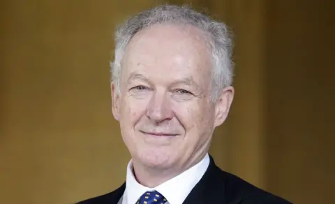 PA Head and shoulders shot of James Daunt against a blurred pale background. He is smiling slightly