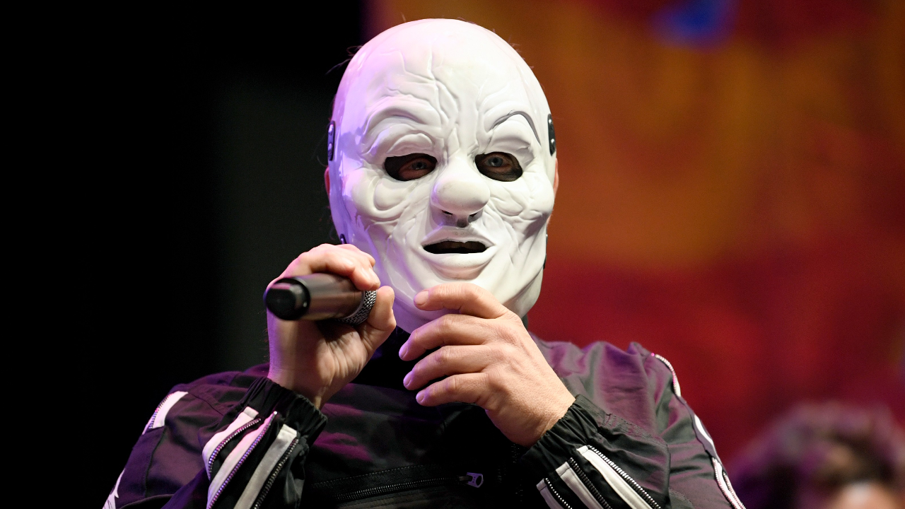 Shawn Clown Crahan of Slipknot wearing a white mask in 2023