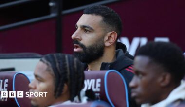 Liverpool's Mohamed Salah on the substitutes' bench