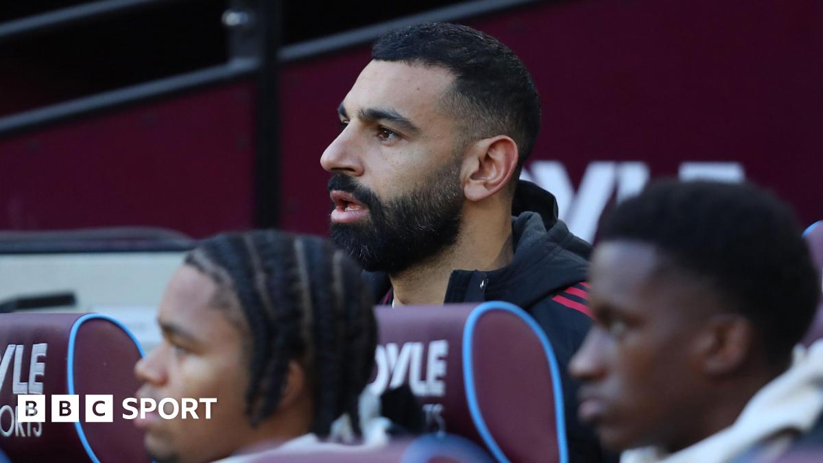 Liverpool's Mohamed Salah on the substitutes' bench