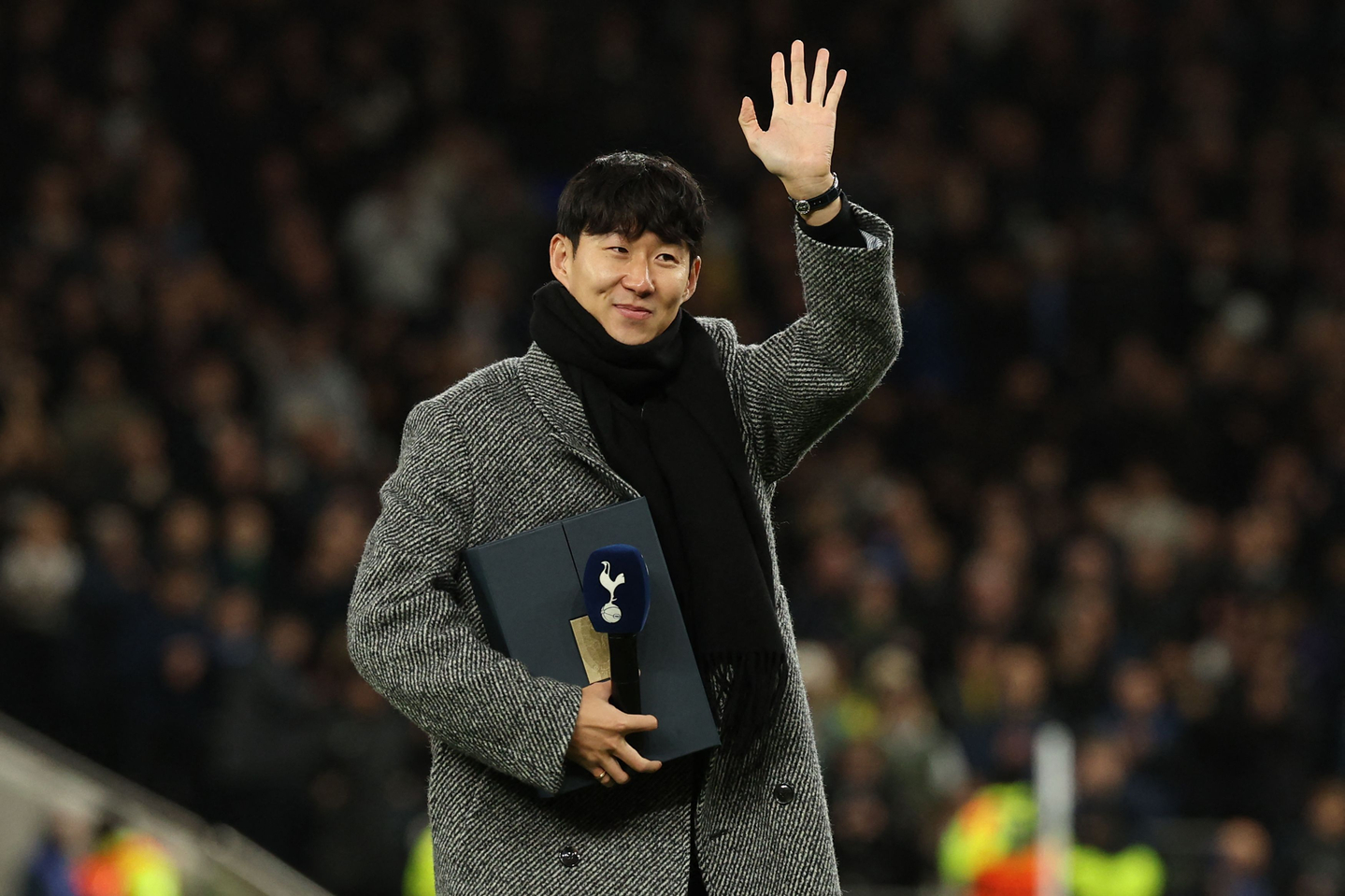 Former Tottenham Hotspur player Son Heung-min, who left the club in the summer, waves goodbye to fans on the pitch ahead of the UEFA Champions League football league stage match between Tottenham Hotspur and Slavia Prague at the Tottenham Hotspur Stadium in London, on Dec. 9. [AFP/YONHAP]